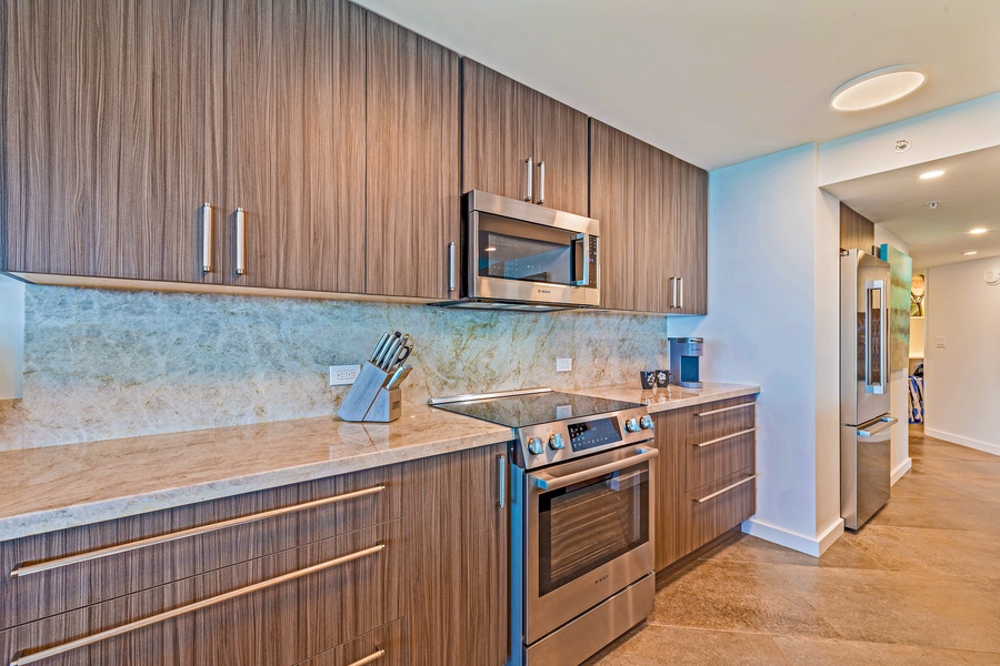 This fully-equipped kitchen offers modern appliances and sleek cabinetry, perfect for preparing meals during your stay.