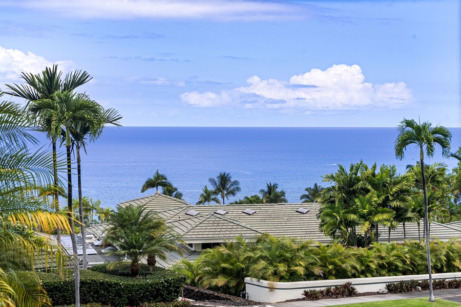 Sweeping coastline vistas stretch endlessly before you from this elevated tropical estate.