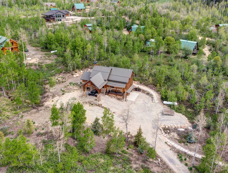 Captivating aerial view of mountain cabin, perfect for a serene living experience