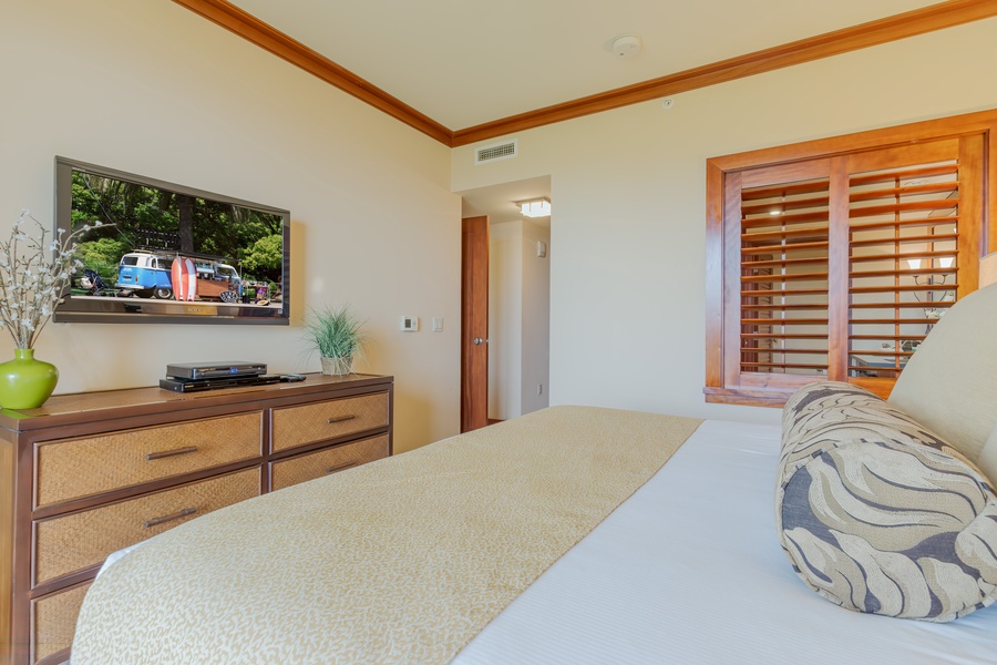 Stylish and serene, the primary bedroom invites rest with luxury linens and calming tones.