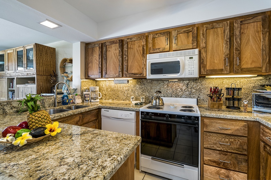 From Mango wood cabinets to granite counters in this kitchen!