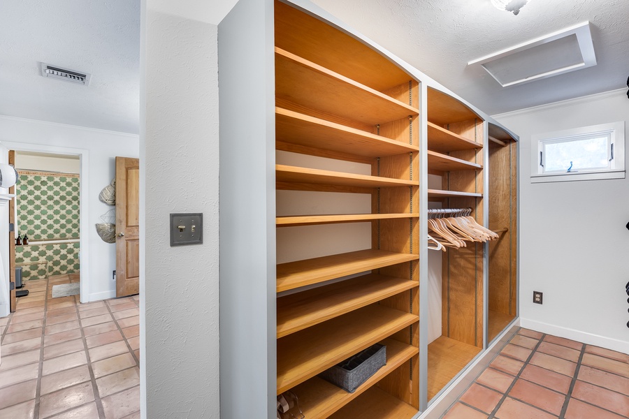 A spacious sanctuary for your wardrobe offering easy access and neat storage.