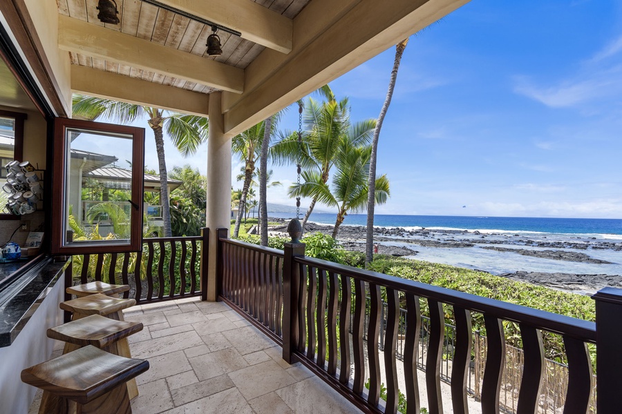 Passthrough kitchen window for service—lounge or dine while the ocean plays backdrop.