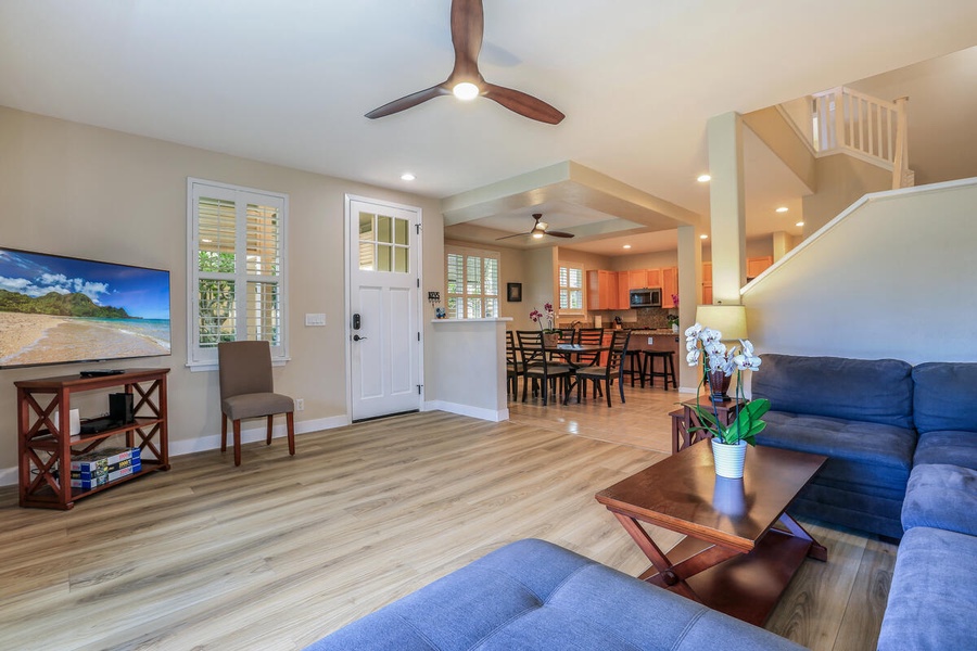 Open concept living and dining area offers a seamless space for both relaxation and entertaining.