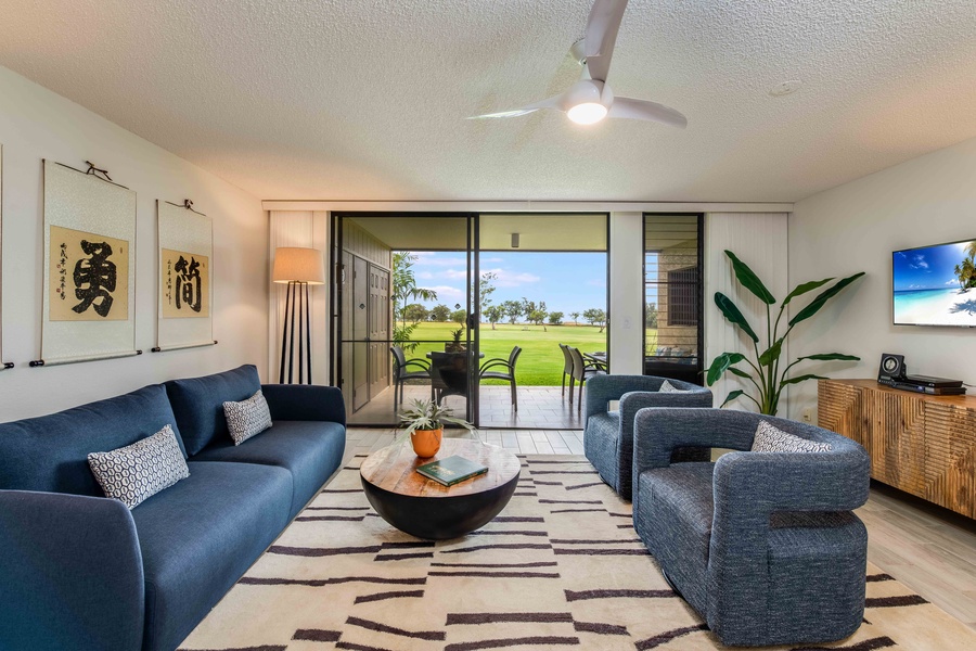 Gaze out at the golf course and distant ocean while lounging in the living room—your private window to paradise.