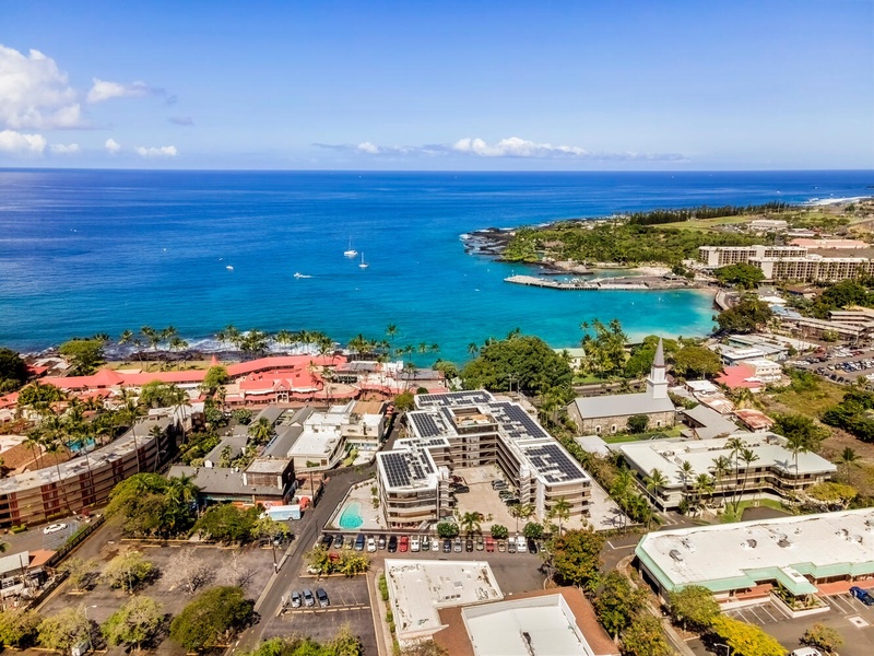 Stunning aerial view of this oceanfront resort with pristine turquoise waters and tropical coastline stretching to the horizon.