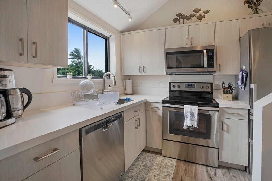 The updated kitchen has stainless steel appliances