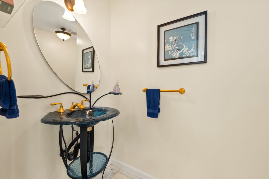 Charming powder room with stylish decor and modern fixtures, ideal for guests.