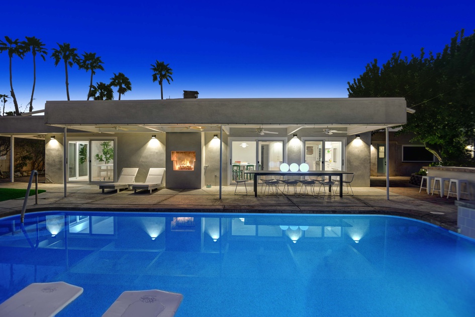 Night pool facing house