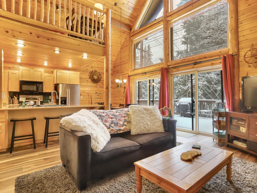 Nestled in the heart of a log cabin, cozy interiors whisper