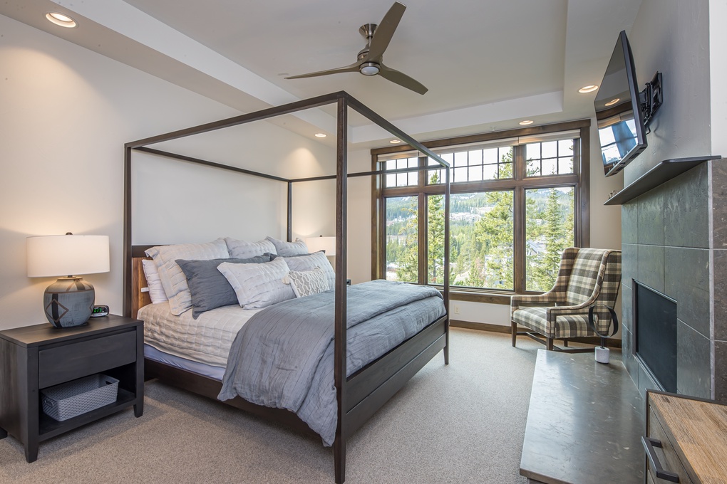 Primary Bedroom with King Bed, Gas-Burning Fireplace, Walk-In Closet, and TV