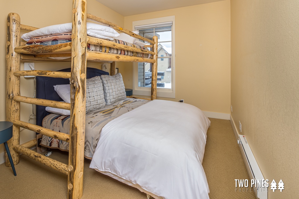 Bunk Room with Twin/Full Pyramid Bunk, Flat Screen TV, and Closet