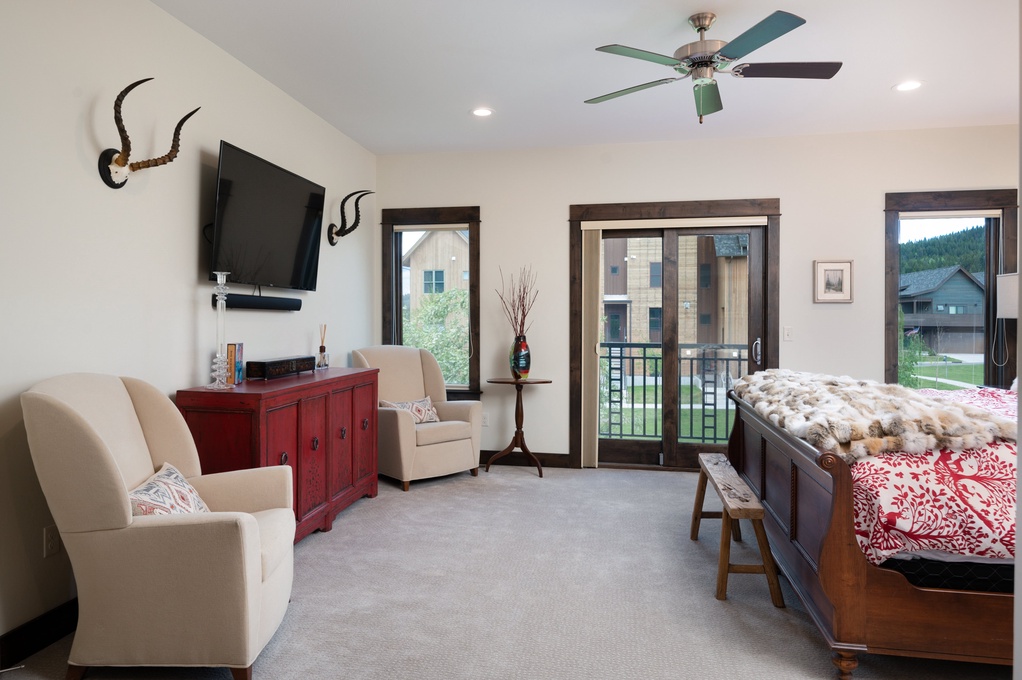 Primary Bedroom with TV and Balcony Access