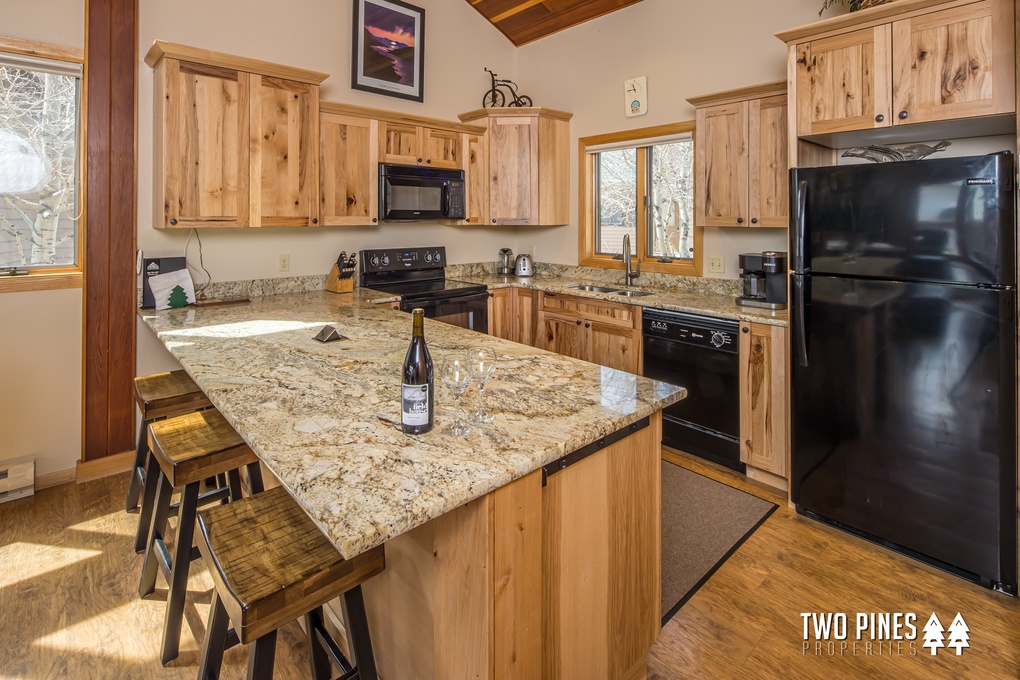 Kitchen with bar seating for 3