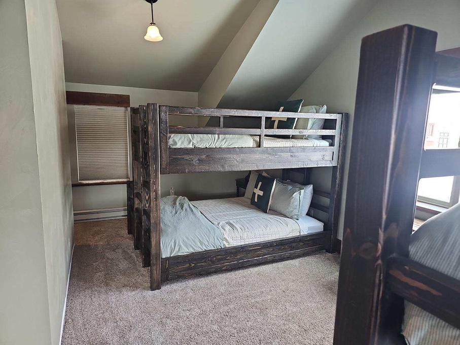 Bunk bed loft area with two twin over queen bunks