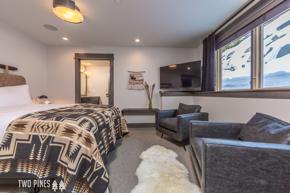 Primary Bedroom with King Bed and TV