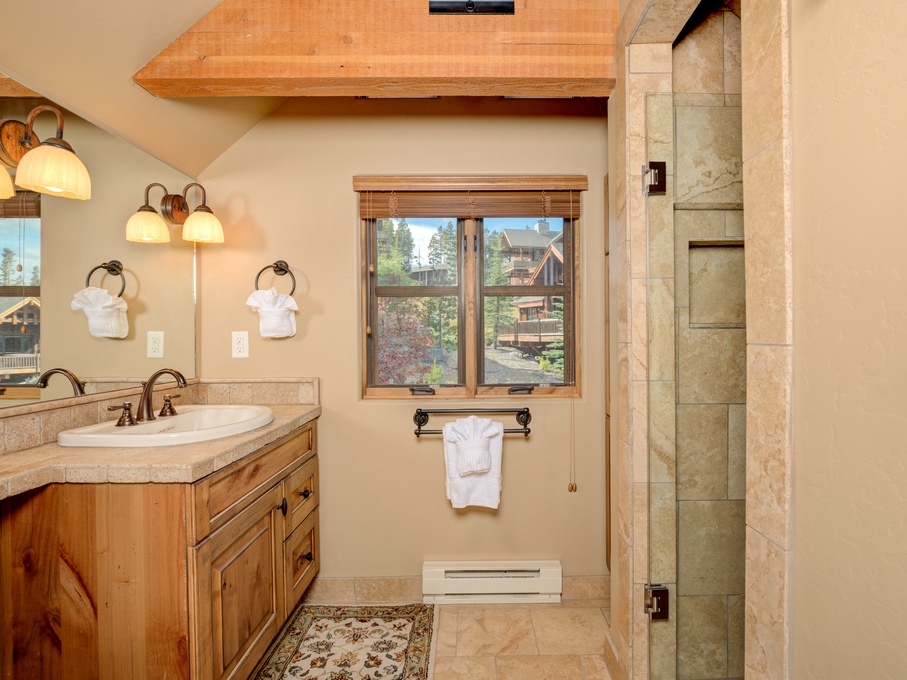 Loft area bathroom with walk-in shower