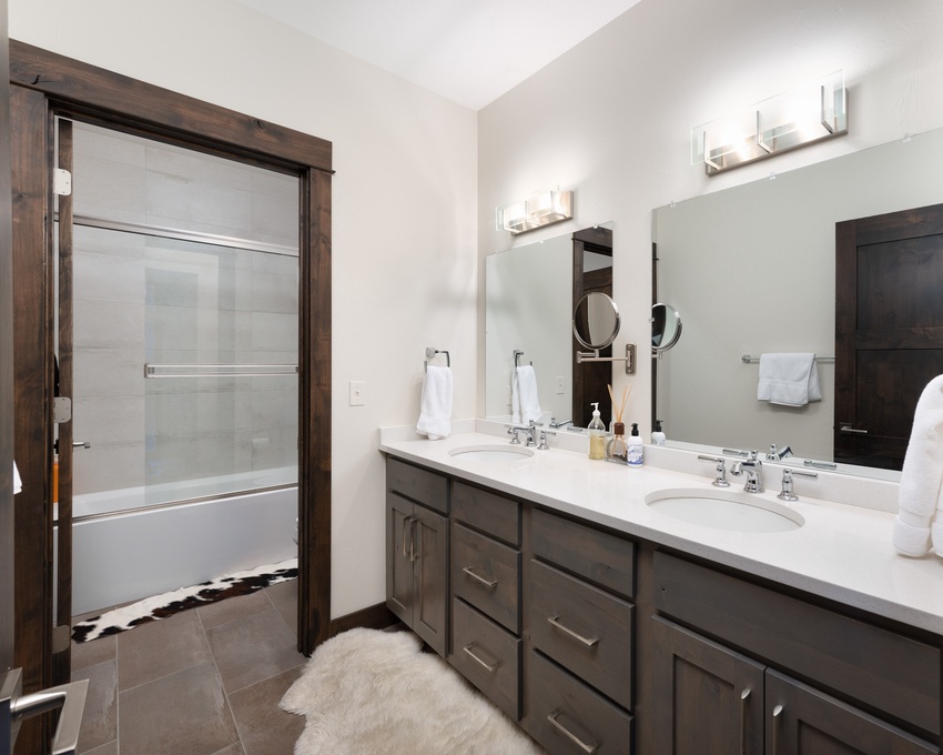 Shared Full Bathroom on Upper Level with Double Vanity and Tub/Shower Combo