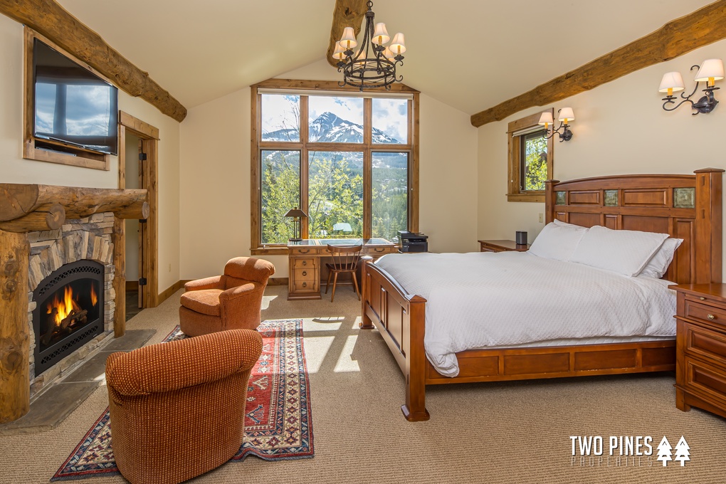 Queen-sized Primary Bedroom with Gas Fireplace and Seating for Two