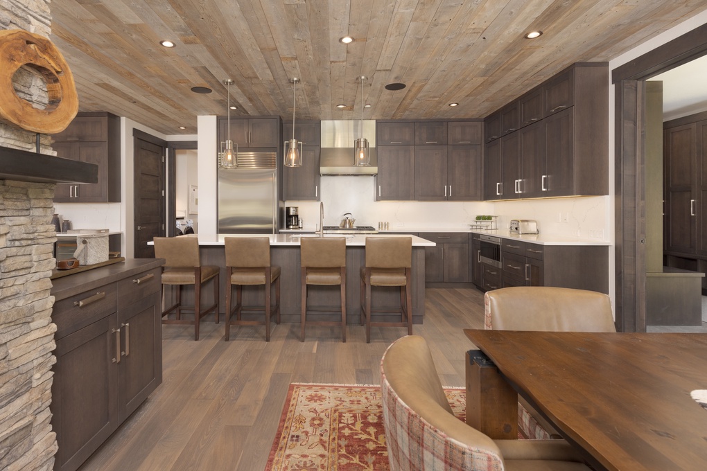 Open Concept Kitchen, Entry to Laundry Room and Mini Bar Area