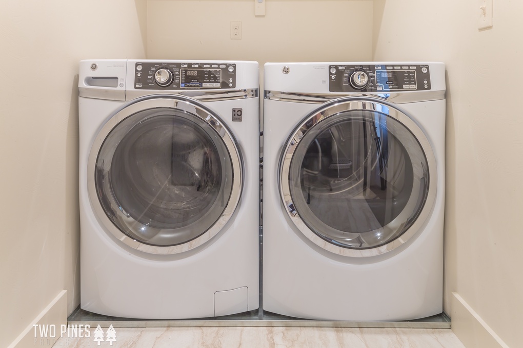 Laundry with supplies in upstairs hallway