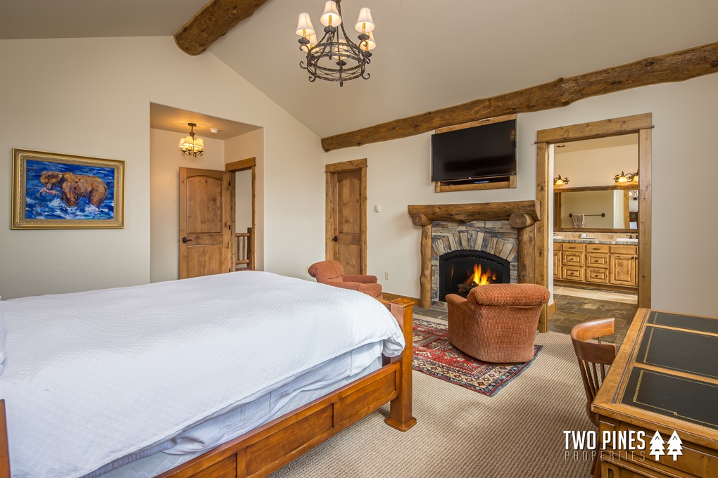 Queen-sized Primary Bedroom with Gas Fireplace and En Suite