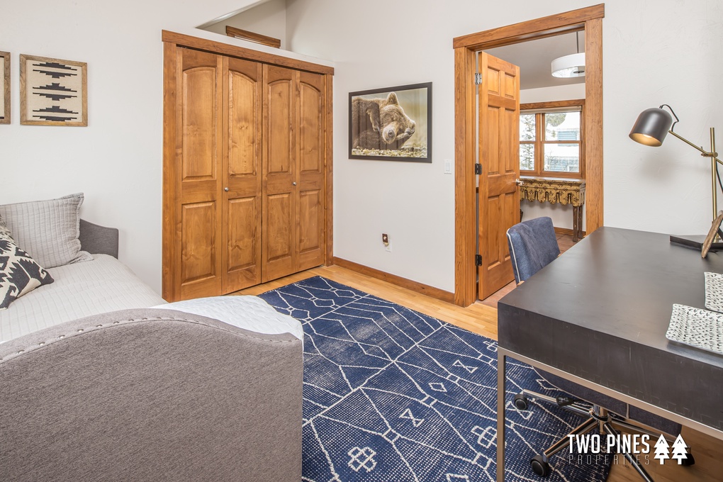 Upstairs Bedroom with Trundle Bed, Desk, and Spacious Closet