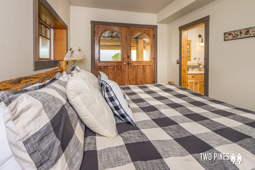 Lower Level Guest Bedroom with Twin Bunk Beds and King Bed