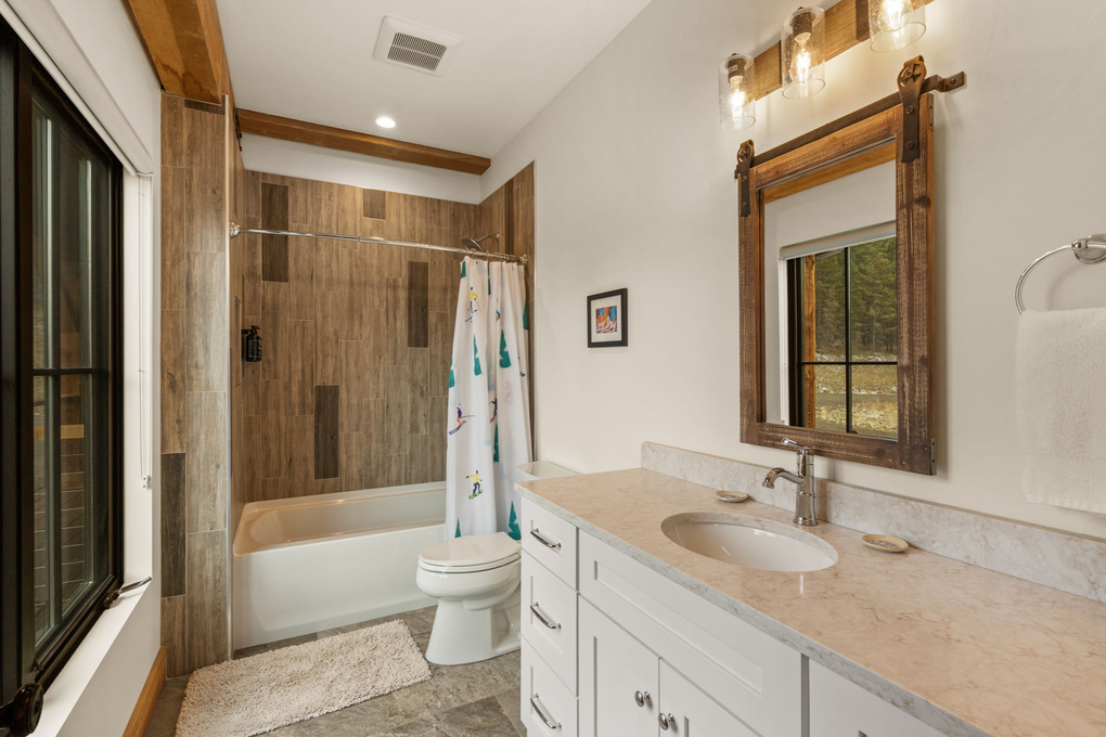 Guest Bedroom 1 - En-Suite Full Bath (main floor)