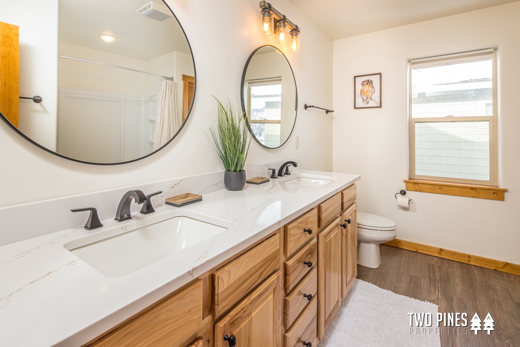 Full Bathroom with Shower/Tub Duo and Dual Vanity