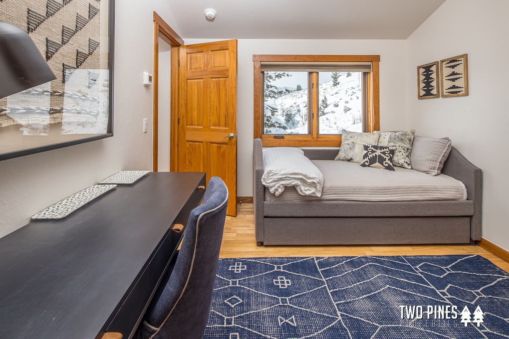 Upstairs Bedroom with Trundle Bed, Desk, and Spacious Closet