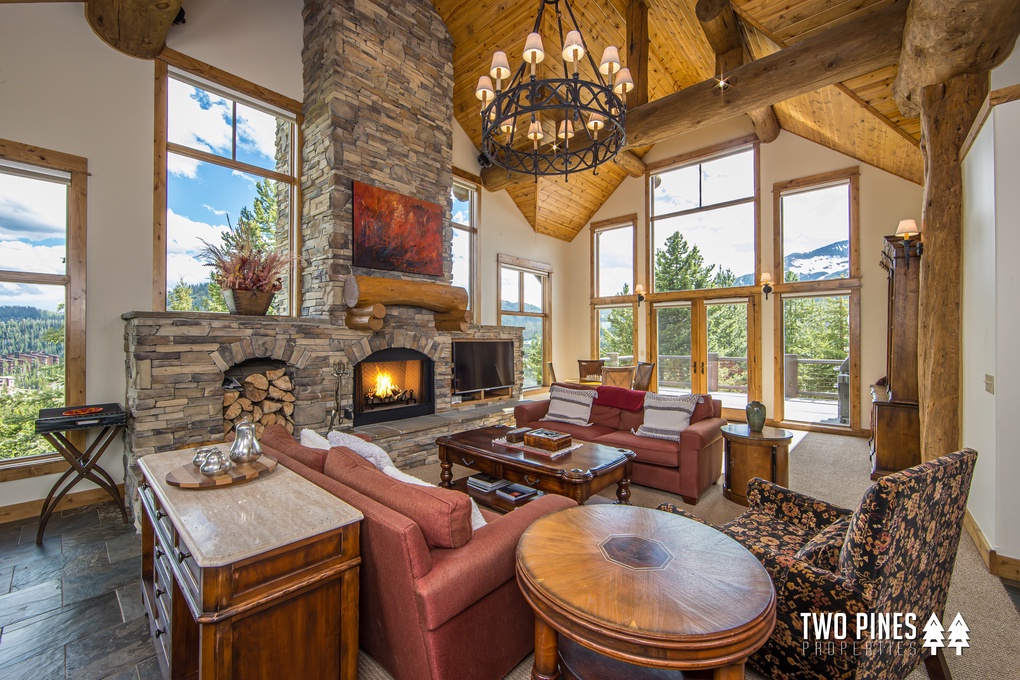 Open Concept Great Room with Wood Burning Fireplace and Patio Access