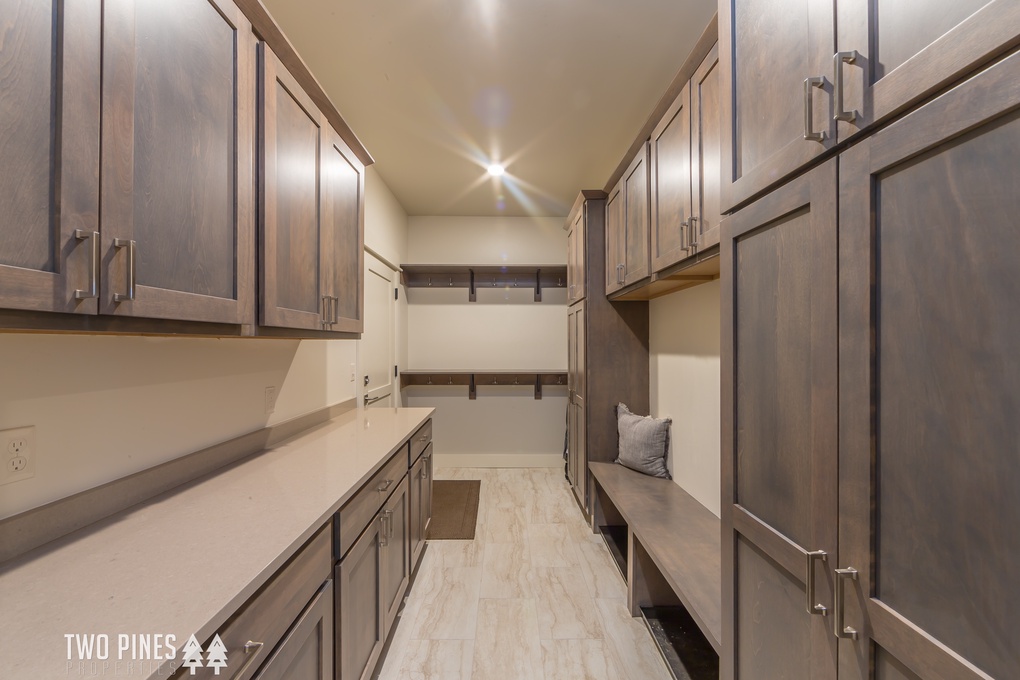 Large entryway mudroom with storage for ski jackets and more