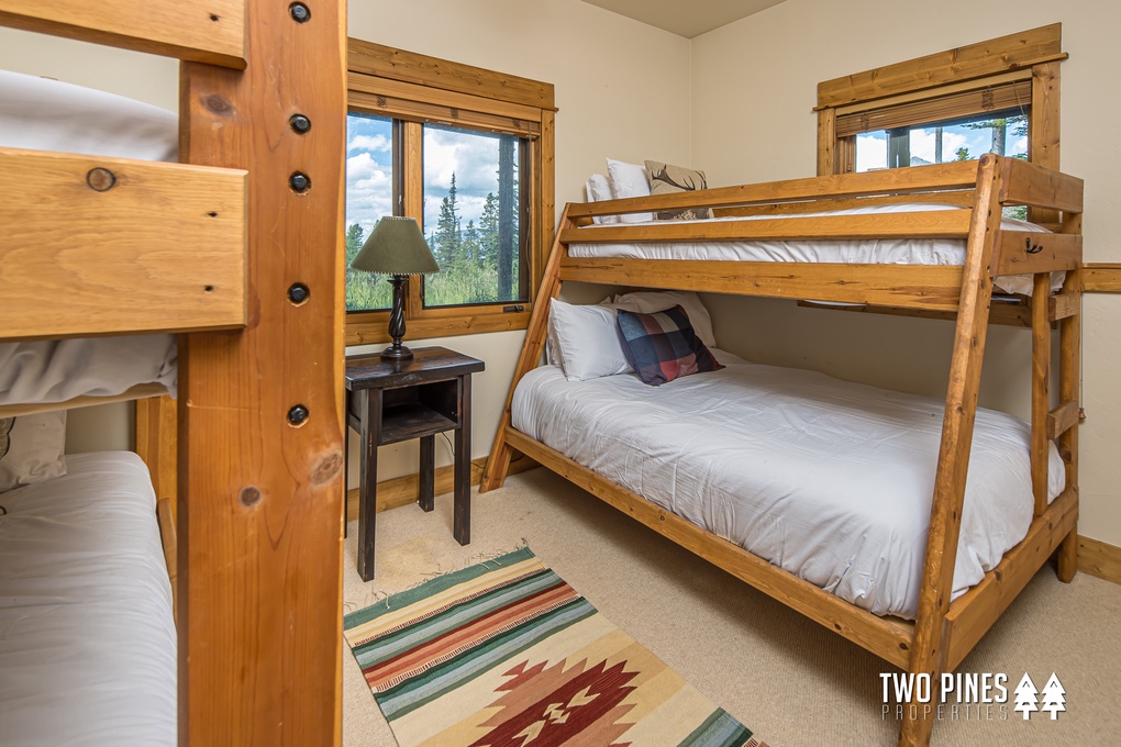 Downstairs twin-size bed over queen-size bunk, twin-size over twin-size bunk.