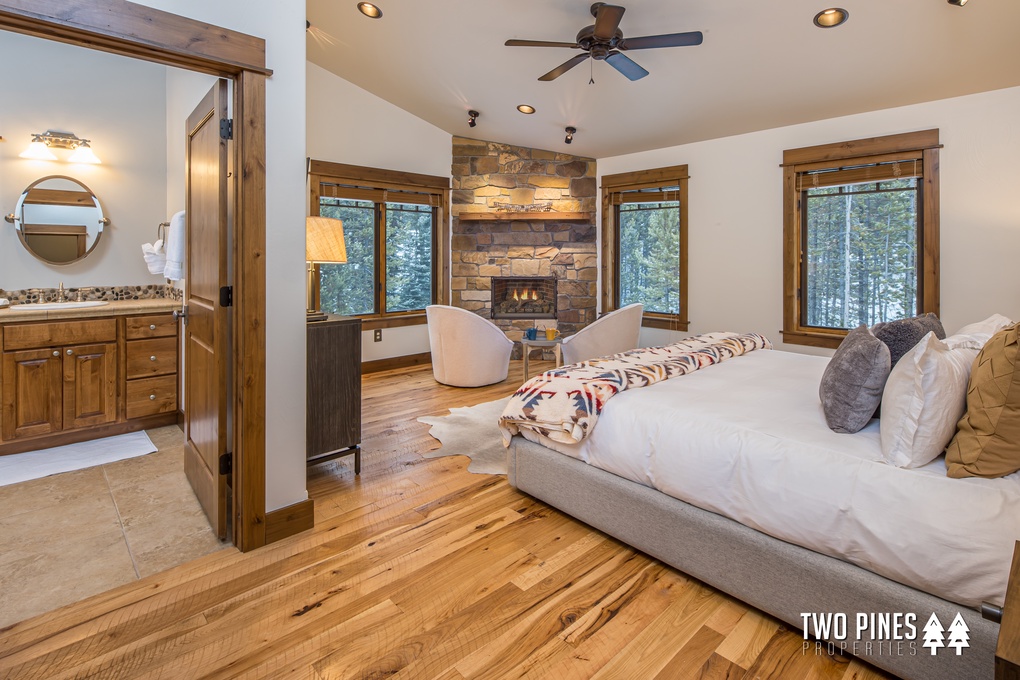 Main Floor Primary Bedroom with Gas Fireplace and King Bed