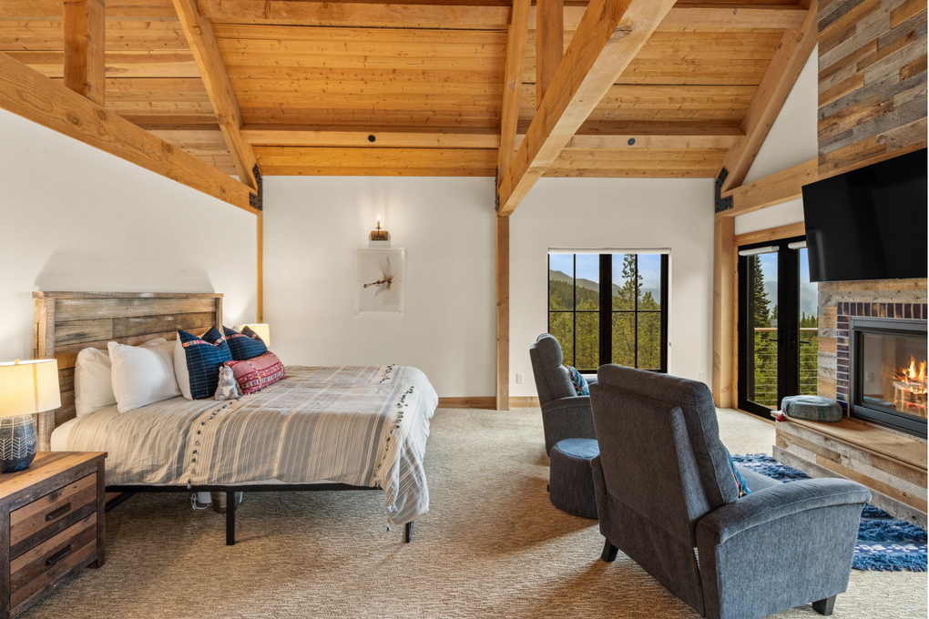 Primary Bedroom w. En-Suite Full Bath, Gas Fireplace, Office and Private Deck (main floor)