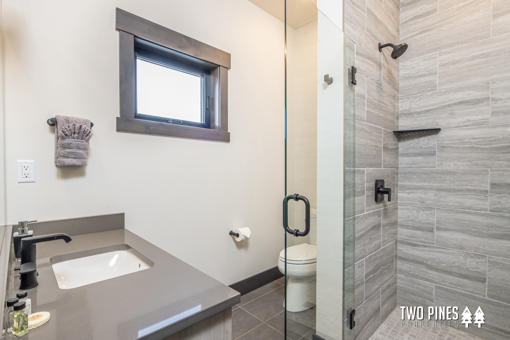 Shared Bath with Single Vanity and Walk-In Shower