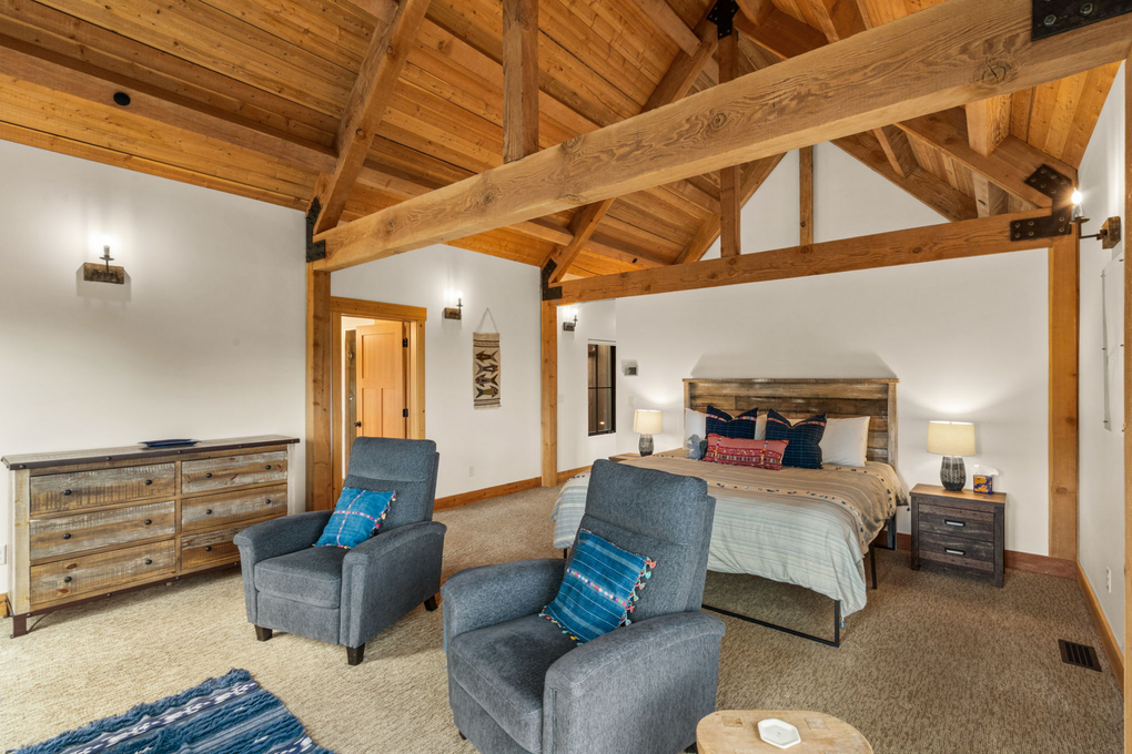 Primary Bedroom w. En-Suite Full Bath, Gas Fireplace, Office and Private Deck (main floor)