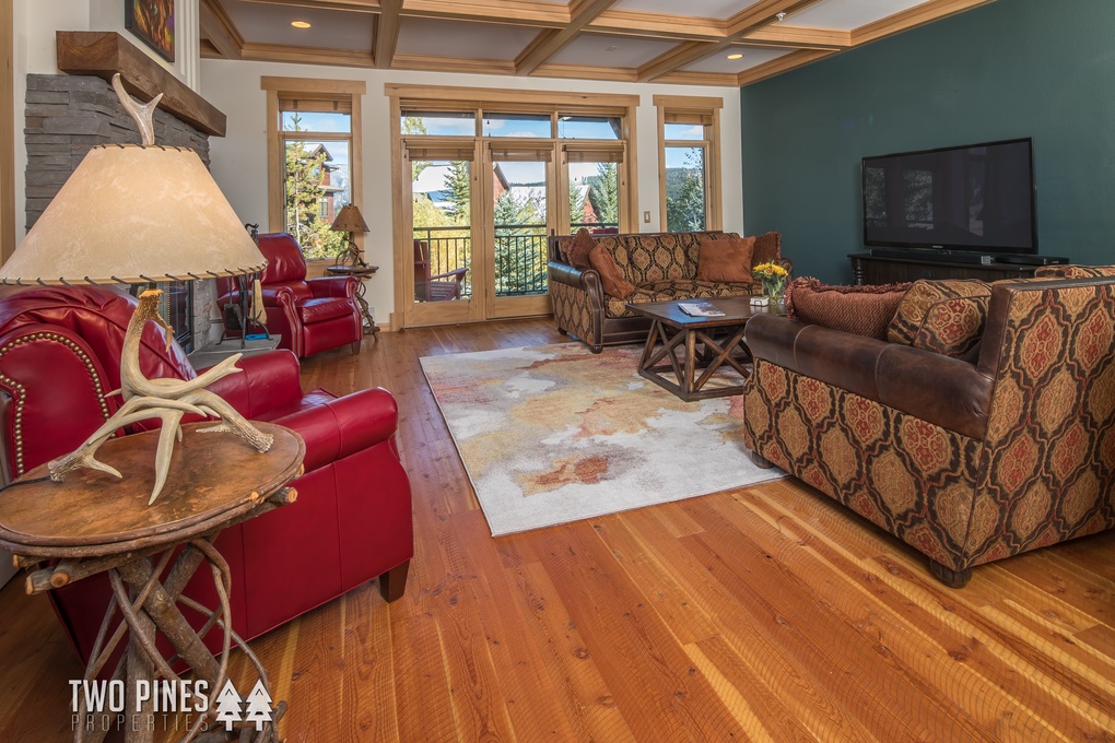 Living Room with Wood Burning Fireplace & Flat Screen TV