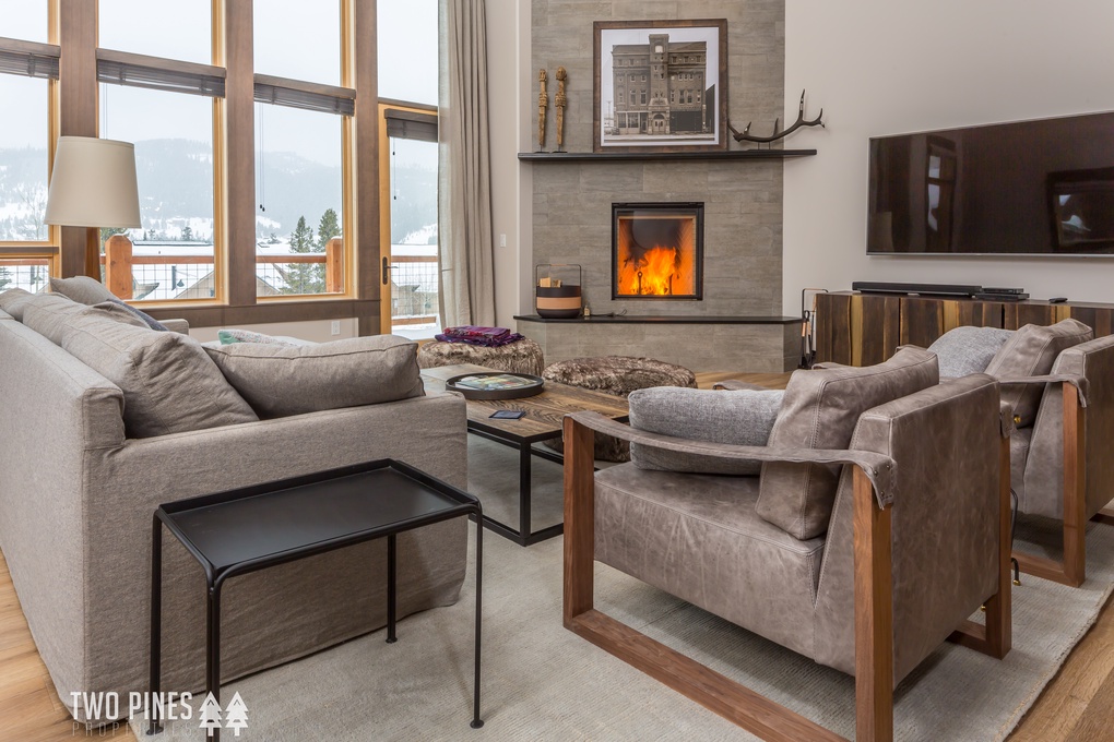 Main Living Room with Wood Burning Fireplace and TV