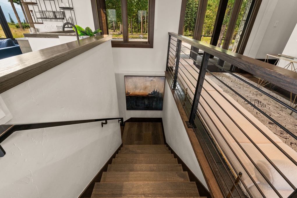 Stairs Behind Living Room Bar, Leading to Den