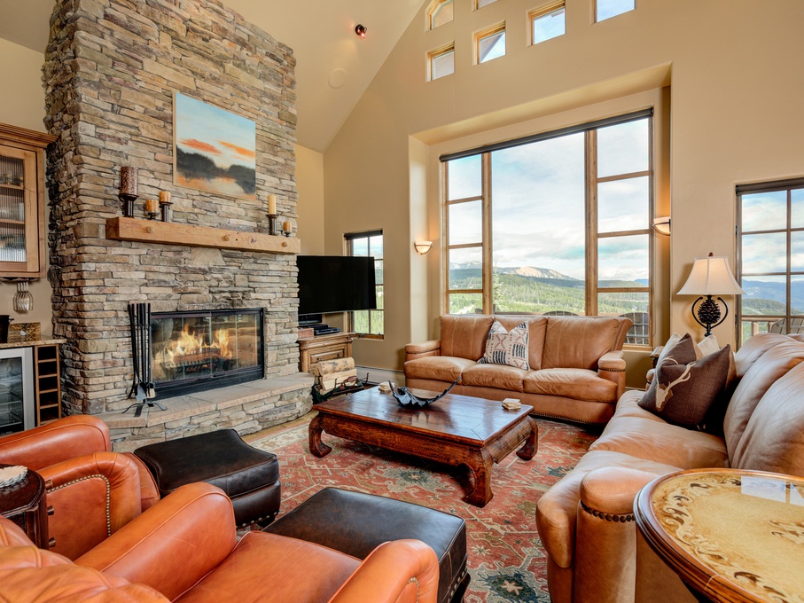 Stunning living room with fireplace and stunning views