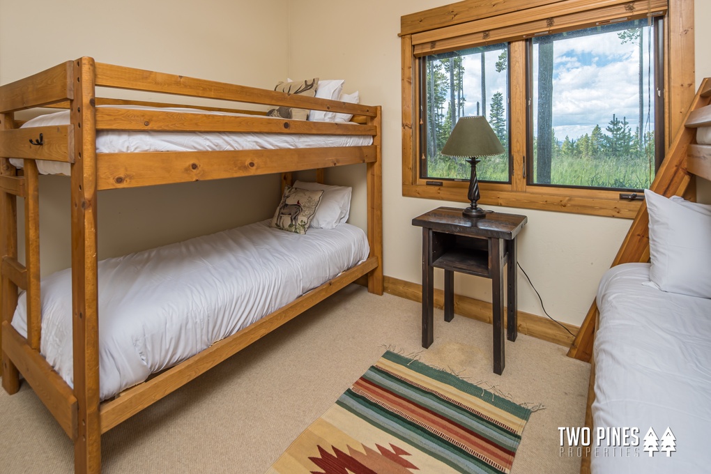 Downstairs twin-size bed over queen-size bunk, twin-size over twin-size bunk.