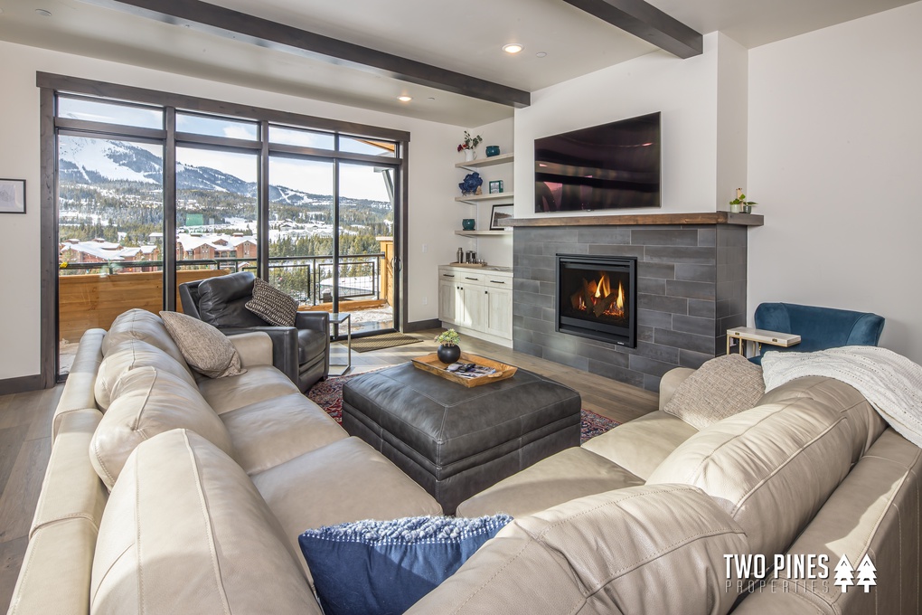Den with gas fireplace, flat screen tv, and breathtaking views of lone peak