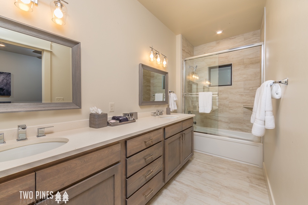 Bunk Room En Suite with double vanity and tub/shower combo