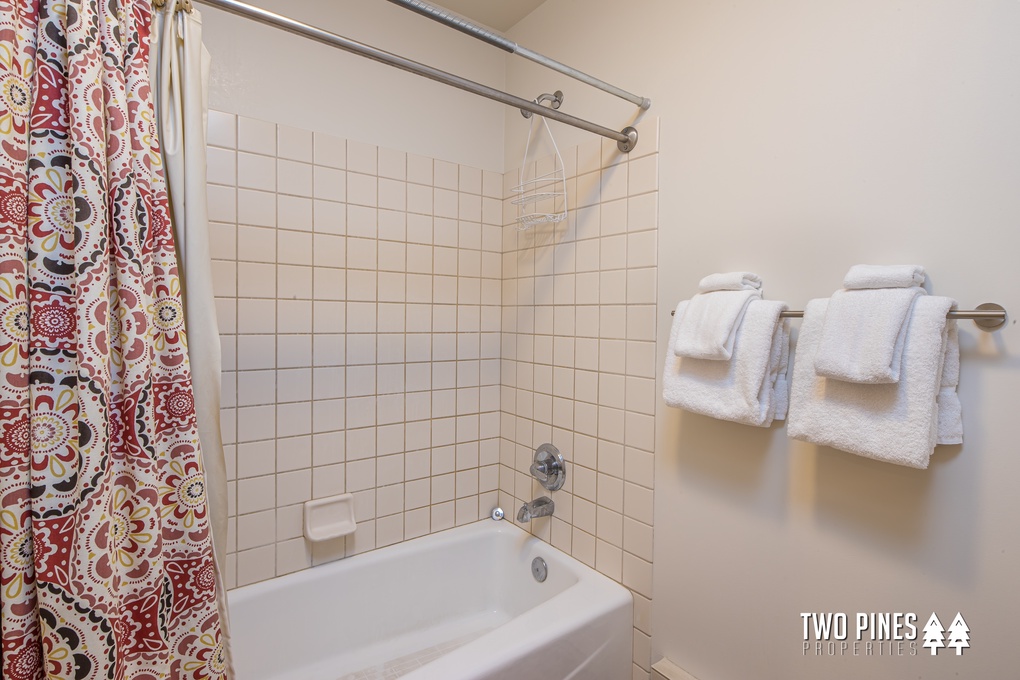 Shared bathroom with Tub/Shower Combo
