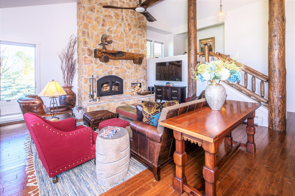 Living Area with Wood Burning Fireplace & Flatscreen TV