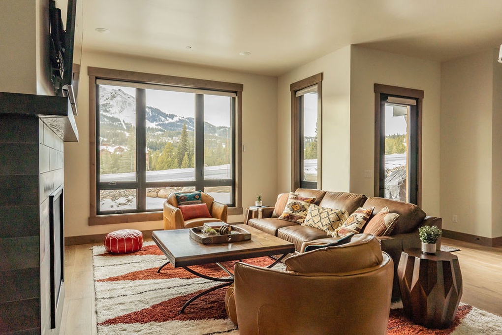 Spacious living area with fireplace.