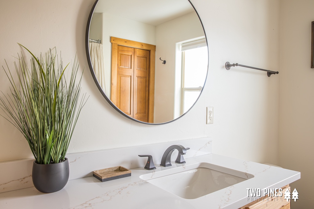 Full Bathroom with Shower/Tub Duo and Dual Vanity