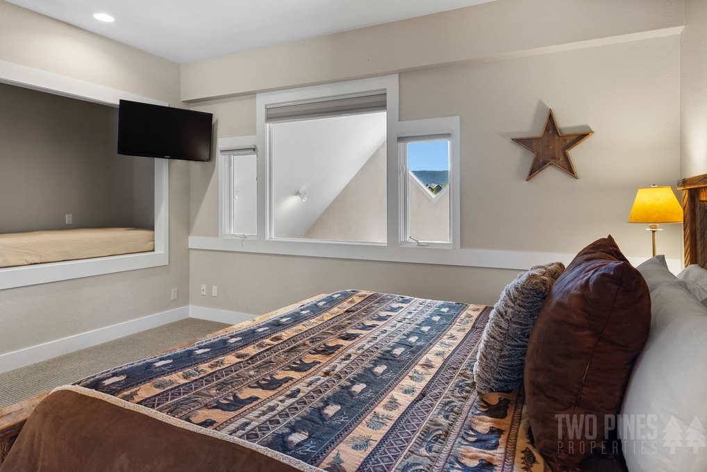 King Bed/Windows Looking Down onto Lower Level